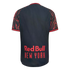 Rear view of a dark gray soccer jersey with red lightning-patterned sleeves and "Red Bull NEW YORK" printed in bold red text on the lower back.
