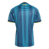 Back of a teal and blue Colombia soccer jersey with a wavy geometric pattern, neon yellow trim, and 'COLOMBIA' printed on the upper back.