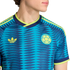 Blue Colombia soccer jersey with a zigzag pattern, yellow Adidas Trefoil logo, and team crest. Features neon yellow accents on the collar and sleeves.