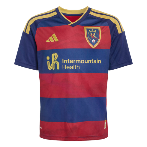 A red and navy blue striped Real Salt Lake soccer jersey featuring gold Adidas logos, shoulder stripes, and the Intermountain Health sponsor.