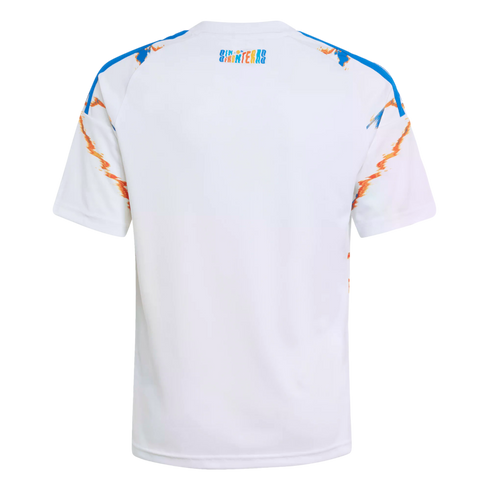 Back view of a white t-shirt with blue shoulder stripes, orange and blue graphic sleeve accents, and a small colorful "SIN FRONTERAS" logo on the upper back.