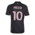 Back of a black Inter Miami soccer jersey featuring the name "MESSI" and number "10" in pink. Small "FREEDOM TO DREAM" text is printed near the collar.