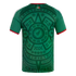 Back view of a green Mexico soccer jersey with a large, dark green Aztec sun stone graphic and red and white trim on the collar and sleeves.