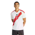Man wearing a white Peru national soccer team jersey with a red patterned diagonal sash and Adidas logo, standing against a black background.