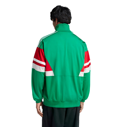 Back view of a person wearing a green track jacket with red and white color-blocked sleeves and white shoulder stripes, set against a black background.