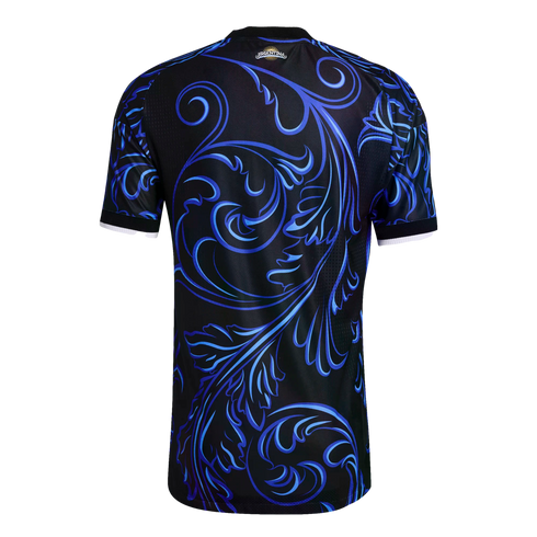 Back view of a black soccer jersey featuring intricate blue scrollwork patterns. A small "ARGENTINA" sun logo sits below the collar. Sleeve cuffs are trimmed in white.