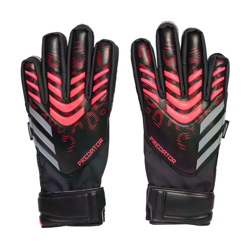 Pair of black Adidas Predator goalkeeper gloves with pink geometric accents and grey stripes, against a solid black background.