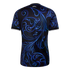 Back view of a black soccer jersey featuring a large, vibrant blue filigree pattern. It includes a small white Argentina logo below the collar and white trim on the short sleeve cuffs.
