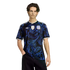 Young man modeling a black Adidas Argentina jersey with a blue swirl pattern, FIFA World Cup champions patch, and AFA crest.