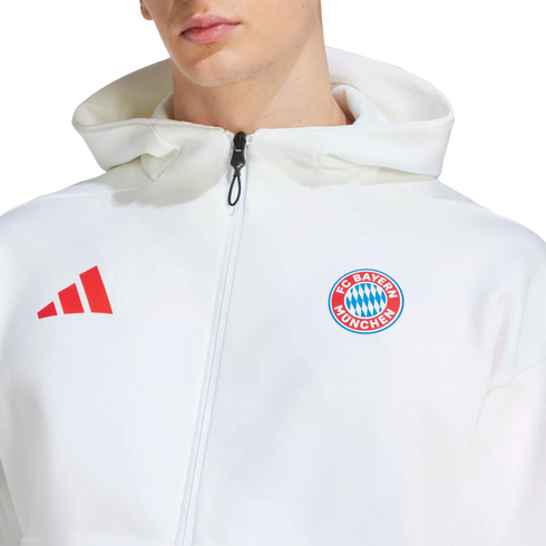 A white Adidas FC Bayern München zip-up hoodie featuring a red brand logo and the team's crest.