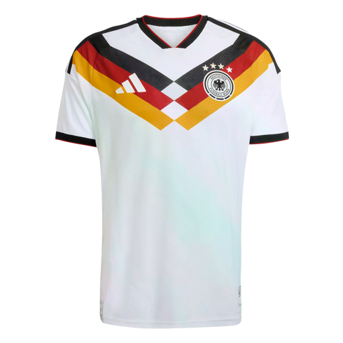 White Germany home football jersey featuring a black, red, and gold geometric chest design, Adidas logo, and team crest with four stars.