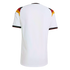 Back view of a white short-sleeved soccer jersey with German flag colors (black, red, and gold) on the shoulders and cuffs, set against a black background.