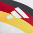 White Adidas logo on textured fabric featuring diagonal black, red, and yellow stripes of the German flag.