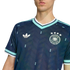 Man wearing a navy blue German soccer jersey with an Adidas trefoil logo, national team crest, and teal trim on the collar and sleeves.