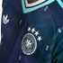 Close-up of a navy blue Adidas Germany soccer jersey featuring the national team crest with four stars and a subtle geometric pattern.