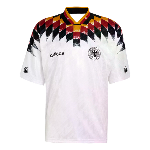White Adidas Germany national team soccer jersey with a bold black, red, and gold diamond pattern across the chest and shoulders, featuring the DFB crest.