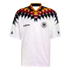 White Adidas Germany national team soccer jersey with a bold black, red, and gold diamond pattern across the chest and shoulders, featuring the DFB crest.