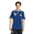 Young man posing in a dark blue Argentina soccer jersey with number 19 and matching shorts against a solid black background.
