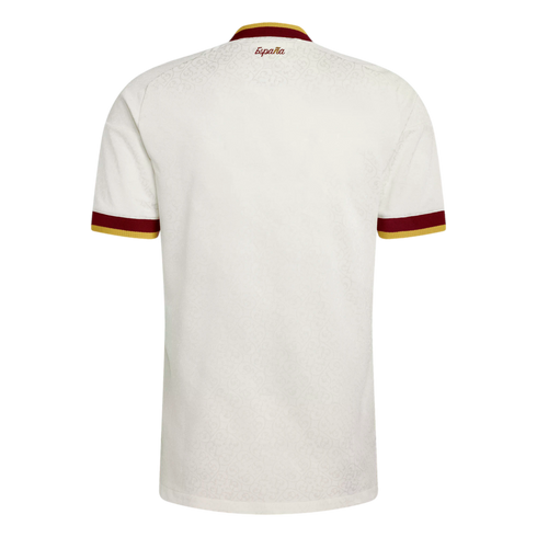 Back view of a cream Spain national team jersey with maroon and gold trim. Features a subtle embossed pattern and "España" printed below the collar.