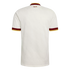Back view of a cream Spain national team jersey with maroon and gold trim. Features a subtle embossed pattern and "España" printed below the collar.