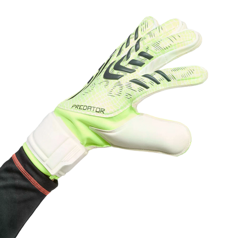 Neon green and white Adidas Predator goalkeeper glove with dark grey patterns, worn on a hand against a black background.