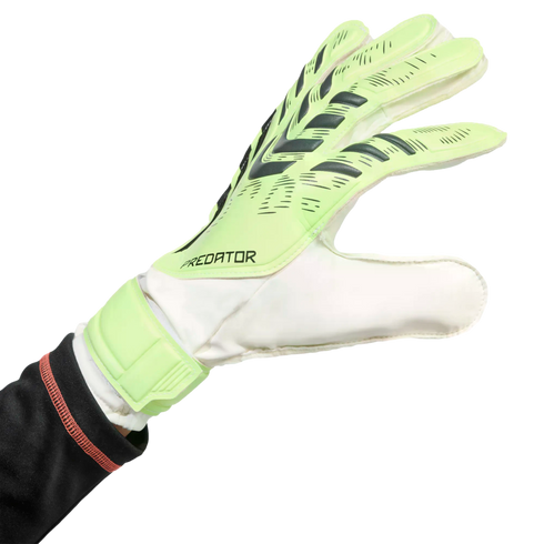 A lime green and white Adidas Predator goalkeeper glove worn on a hand against a black background.