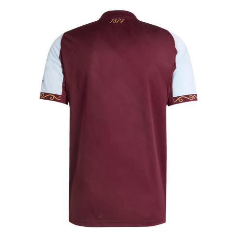 Back view of a claret and light blue football jersey with gold decorative patterns on the sleeve cuffs and "1874" printed on the back of the neck.