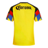 The back of a bright yellow soccer jersey with a black "Corona" logo across the shoulders and colorful geometric patterns on the sleeves.