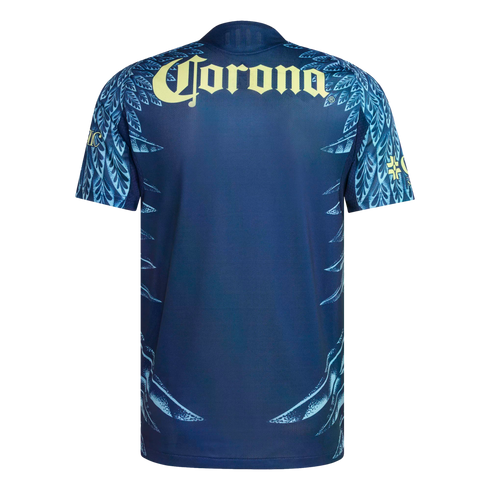Back of a navy blue soccer jersey featuring a yellow "Corona" sponsor logo and light blue feather patterns on the sleeves and sides.
