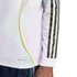 Side view of a white long-sleeve athletic shirt featuring black stripes on the sleeve, a yellow curved accent line, and "AEROREADY" text near the bottom hem.
