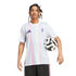 A man with dreadlocks wears a pastel-striped Juventus soccer jersey and black shorts, holding a soccer ball against a white background.