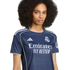 A woman with a large afro wears a navy blue Real Madrid soccer jersey with white trim and "Emirates Fly Better" sponsor text.