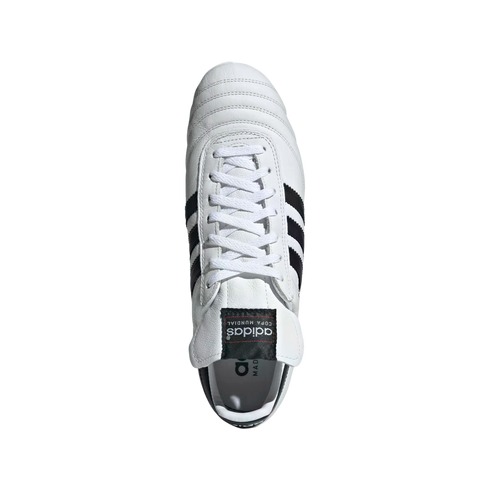 Top-down view of a white Adidas Copa Mundial soccer cleat with black stripes and laces, isolated on a black background.