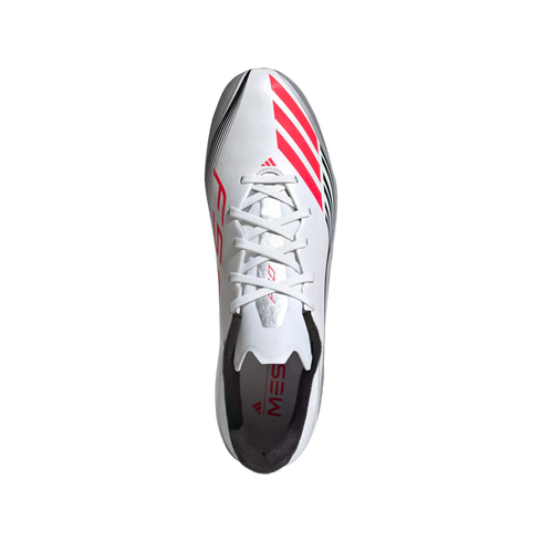 Top-down view of a white Adidas Messi soccer cleat featuring bright pink stripes, silver details, and white laces.