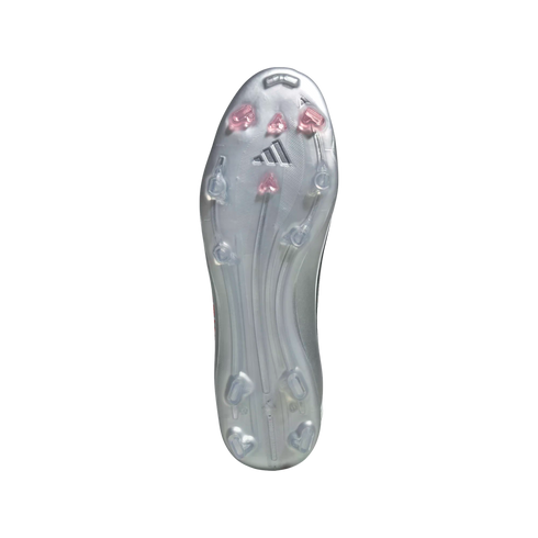 Bottom view of a silver Adidas soccer cleat featuring a metallic soleplate with pink-tipped and clear studs and the Adidas logo.