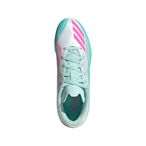 A top-down view of a white Adidas F50 Messi soccer cleat with pink and teal accents, featuring the 'MESSI' logo inside, isolated on a black background.
