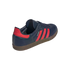 Rear-side view of a navy blue Adidas Samba sneaker with three red stripes, a red heel tab, and a brown gum rubber sole.