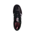 Top-down view of a black Adidas sneaker with three white stripes and a pink Juventus logo on the tongue. The shoe features black laces and a pink insole.
