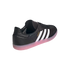Rear-three-quarter view of an Adidas Samba sneaker featuring a black leather upper with three white stripes and a translucent pink gum sole.