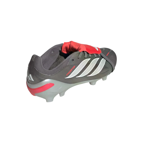 A dark grey Adidas Predator soccer cleat with white stripes and a red fold-over tongue, shown from a rear angle on a black background.