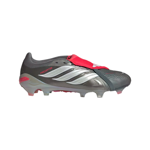 A metallic grey Adidas Predator soccer cleat with white stripes and a red fold-over tongue, shown in profile against a black background.