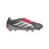 A metallic grey Adidas Predator soccer cleat with white stripes and a red fold-over tongue, shown in profile against a black background.