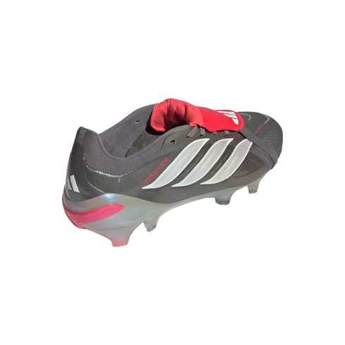 Gray Adidas Predator soccer cleat with white stripes, a prominent red fold-over tongue, and translucent studs, isolated on black.