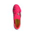 A top-down view of a bright pink Adidas Predator soccer shoe with black accents and a yellow insole, set against a solid black background.