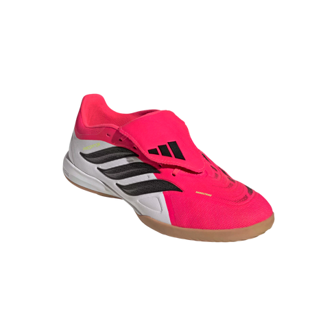 A bright pink and white Adidas Predator indoor soccer shoe with black stripes, a fold-over tongue, and a gum rubber sole.