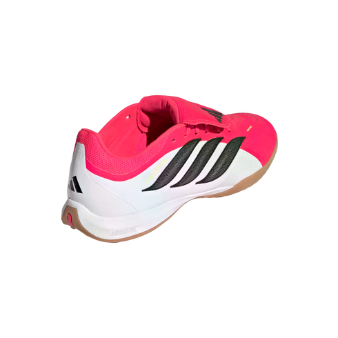 A side-rear view of an Adidas Predator indoor soccer shoe in pink, white, and black with a gum rubber sole and "Lightstrike" cushioning.