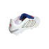 A white Adidas Predator soccer cleat with a blue fold-over tongue and black stripes, shown from the side on a black background.
