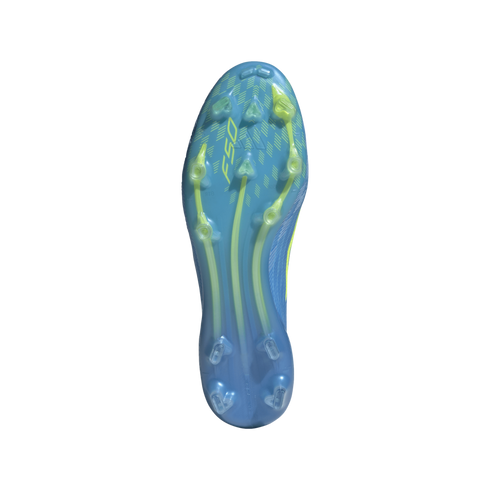 A top-down view of the blue and lime green soleplate of an F50 soccer cleat, featuring various stud shapes for traction, against a black background.