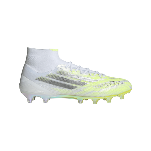 White and neon yellow Adidas soccer cleat with silver metallic stripes, shown from a profile view against a black background.