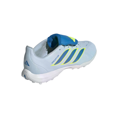 A light blue Adidas Predator turf soccer shoe shown from a three-quarter rear view, featuring dark blue stripes with neon yellow outlines and a blue fold-over tongue.